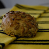 A grain roll lies on a shawarz yellow scarf