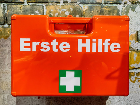 Orange emergency kit hanging on a wall