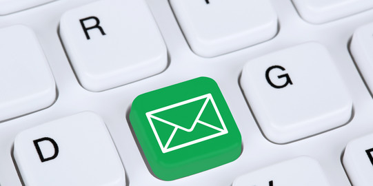 email Close-up of a white keyboard. Between D and G is a green key with an envelope on it